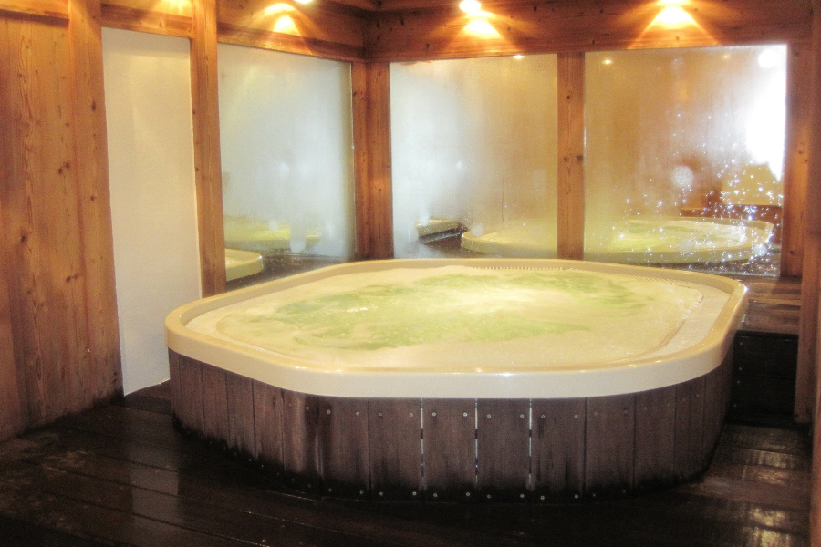 jacuzzi room with warm lighting
