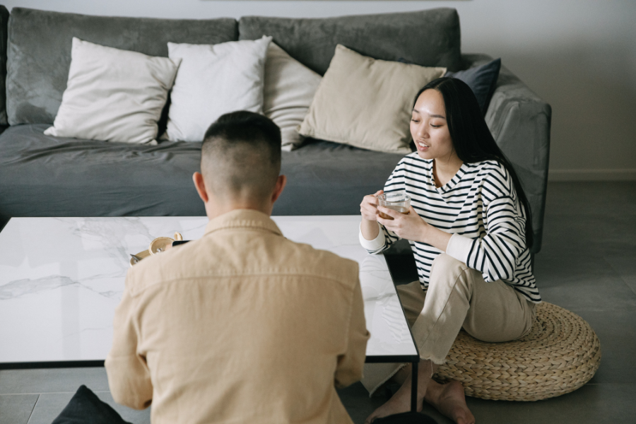 couples in a room sitting near the sofa