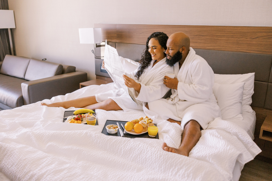 Couple relaxing in a hotel room during a romantic Kansas City getaway